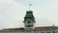 Clock tower with waving italian flag at the top 10150556