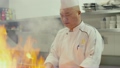 Asian restaurant kitchen, chinese chef cooking food, man as successful professional cook working 12323062