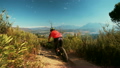 Mountain biker riding on a cross country dirt road  14948014