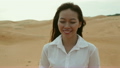 Asian woman smile outdoor desert wind blowing hair 18768511