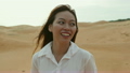 Asian woman smile outdoor desert wind blowing hair 18768512