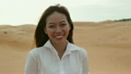 Asian woman smile outdoor desert wind blowing hair 18768515