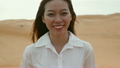 Asian woman smile outdoor desert wind blowing hair 18776762