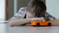 sad little boy lying on the floor at home 32164989