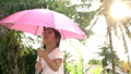 Little girl holding umbrella in rainy day 33411348