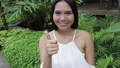 woman giving two thumbs up, montage 34938047