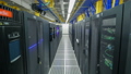 room with rows of server hardware in data center 37731784