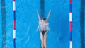 A woman practices her breaststroke and splashes 37905726