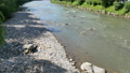 Mountain river in the Carpathians. Muddy dirty water flows through the rocks. 44016734
