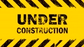 Yellow background with under construction sign 56646798