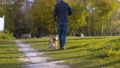 The man walking with the corgi dog 57976090