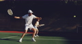 Woman and man playing tennis on a sunny day 59228192