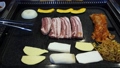 Video of setting pork belly meat and vegetables 64413750