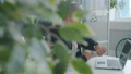 Slow motion of business man typing with laptop then using digital watch touching display 69903577