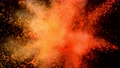 Super slow motion of coloured powder explosion isolated on black background. 70664391