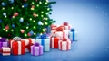 Decorated Christmas tree and gift boxes on blue background 70867591