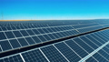 Drone shot of solar panel rows at a solar power facility 71386435
