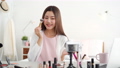 Asian woman beauty influencer doing cosmetic makeup online live streaming 71678595