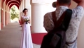 Professional wedding photographer taking portraits of young beautiful bride near the columns 74359657