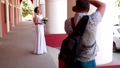 Professional wedding photographer taking portraits of young beautiful bride near the columns 74359658