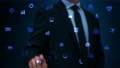Businessman working on holographic interface. Financial. Blue. Man touching a visual screen with holographic computer icons. Financial diagrams appearing. More color options in my portfolio. 75167603