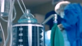 Close-up of a ventilator during an operation, FullHD shot. The movement is remembered by artificial lung ventilation, amid a ward with a patient and doctors. Pneumonia and tuberculosis, Covid 19 82191691