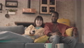 Multiethnic Couple Watching TV at Home 84329120