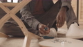 Man Using Screwdriver while Assembling Furniture 84335001