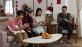 asian family ignoring each other while spending time on mobile phones. vr games and video games at home. emotional son shouting while playing. translation: spring and congratulations 84906253