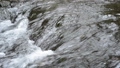 A shallow river flowing over the bedrock 85558030