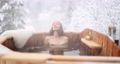 Woman relaxing in hot bath at snowy mountains 85628472