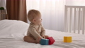 Baby Development. Cute Infant Child Playing With Colorful Building Blocks On Bed 85881769
