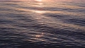 太陽の光が射す沖縄の夕方の海面 85912279