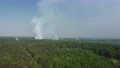 Large smoke clouds and fire spread. Aerial view of smoking wild fire 86588162