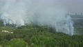 Large smoke clouds and fire spread. Aerial view of smoking wild fire 86588163
