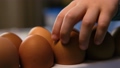 A little child paints an easter egg. 87236539