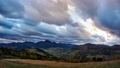 Rural mountain landscape at dusk.Dense clouds at sunset.Leaves on the trees colored in autumn colors. High quality 4k footage, timselapse 87383364