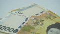 Counting korea money banknotes 88978216