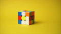 Rubiks cube at yellow background 89046226