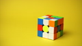 Rubiks cube at yellow background 89046452