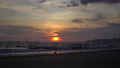 4K footage of a sunset on the beach with a stunning outdoor landscape in the background. 89298189