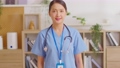 Asian female doctor with a stethoscope smile looking at camera.Nurses wear scrub smile with heartwarming comfortable.Positive emotional and good moment.Health Care Concept 89723886