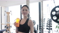 Young woman hydrating in the gym 89784796