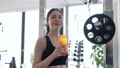 Young woman hydrating in the gym 89784797
