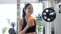 Young woman hydrating in the gym 89784798
