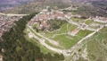 Scenic aerial view of historical area of Albanian city of Berat on hilltop surrounded by fortified walls of ruined medieval castle on spring day 90973102