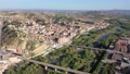 Scenic spring aerial view of El casco or Fraga la Vieja, old historic district of Spanish town of Fraga located on hilly Cinca river valley on sunny day 90973136