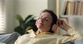 Peaceful mature lady in wireless earphones listen to audio book 91079630