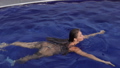 Attractive woman in swimming pool on roof 92377547