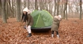 Autumn season. Two kids on a picnic, pretten black girls pputting a camping tent in an autumn forest. 92433254